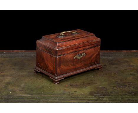 A George III mahogany tea caddy, circa 1770, in the manner of John Channon, the hinged rectangular cavetto moulded top centre