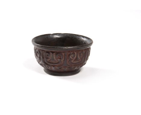 A Chinese carved Tixi lacquer bowl, Ming Dynasty, the bowl supported on a short foot rises to a slightly everted mouth rim, t