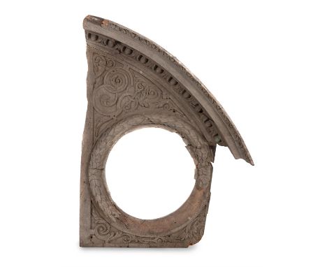 A carved wood architectural feature, first half 18th century, the arched egg and dart moulded cornice above the central wreat