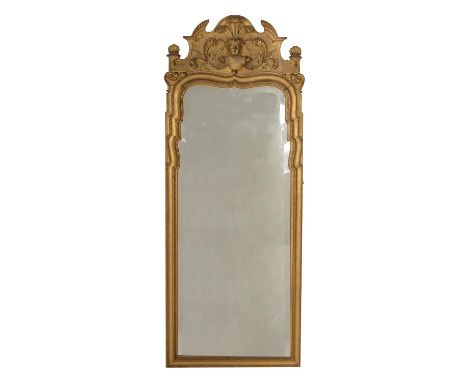 A George I carved giltwood wall mirror, circa 1720, in the manner of John Belchier or James Moore, the shaped rectangular bev