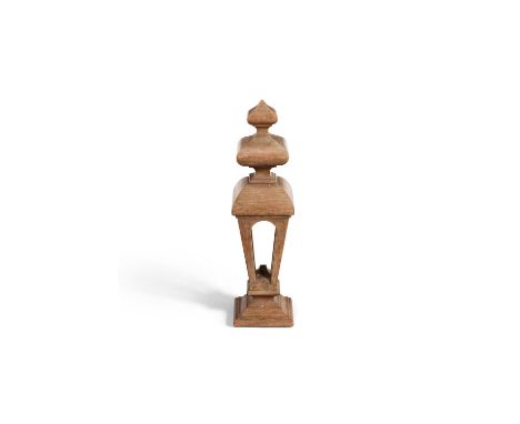 A large James I oak staircase finial, circa 1620, of pierced lantern form with two graduated knops, 78cm high, the base 21 x 