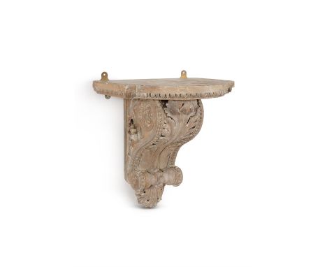 A carved pine architectural wall bracket, of large proportions, probably first half 19th century, the shaped top with egg and