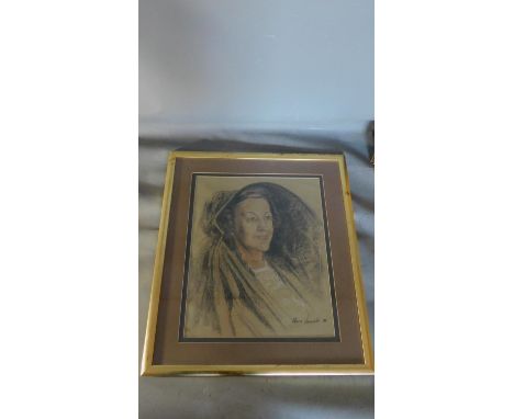 A framed and glazed pastel portrait of a lady, signed. 70x60cm 