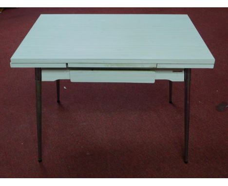 A vintage 1960's French Supermatic ?Le Tubmenager' extending dining table by Brevet, with formica top, having single drawer r