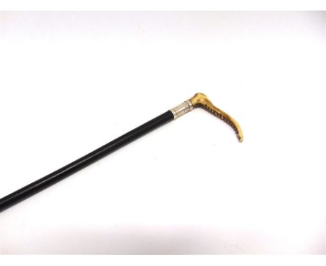 A LADIES HUNTING CROP with horn grip, silver collar & plaited leather shaft, by 'Swaine & Adeney, London'