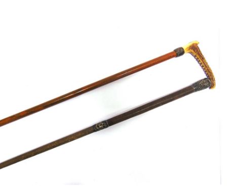 A LADY'S/CHILD'S HUNTING WHIP with carved horn grip, plated basket weave collar and bamboo shaft, (lacking lash); and a ridin
