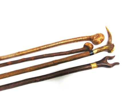 FOUR ASSORTED WALKING STICKS including one with antler grip and a thumb stick