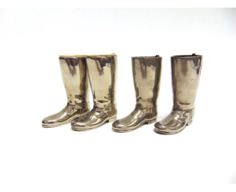 A PAIR OF MINIATURE PLATED HUNTING BOOT TOOTHPICK HOLDERS and another similar pair of miniature hunting boots, 9cm high