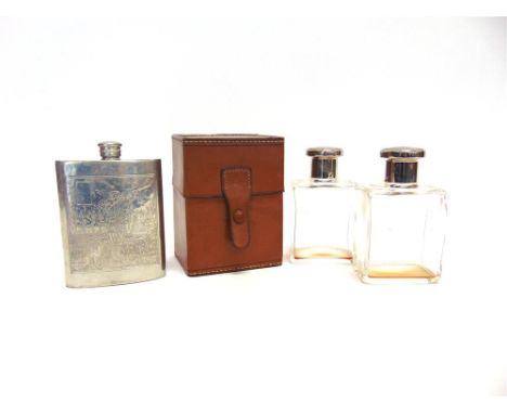 A PAIR OF RECTANGULAR GLASS SPIRIT FLASKS with plated screw tops, contained in a fitted leather case and pewter hip flask wit