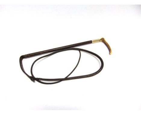 A LADIES HUNTING WHIP with horn grip, plated collar, and plaited leather shaft and thong