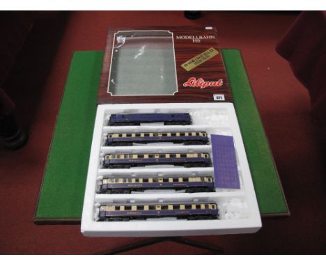 A Boxed Liliput "HO" Scale #820 Deutsche Reichsbahn Five Coach Rolling Stock Set, purple and cream livery 'Rheingold'. 