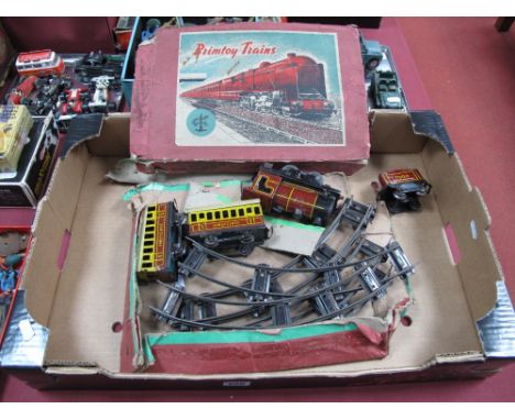 A Mid XX Century 'O' Gauge Tinplate Train Set by Brimtoy, clockwork. Made up of 0-4-0 locomotive and tender and two coaches. 