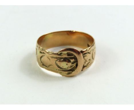 A 9ct gold buckle ring with engraved decoration, finger size R centre, 4.3g gross