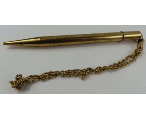A 9ct gold mechanical pencil, Jonathan Matthews & Co, with engine turned decoration and inscribed cartouche; together with an