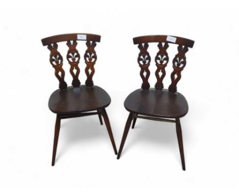 Two Ercol dark elm dining chairs