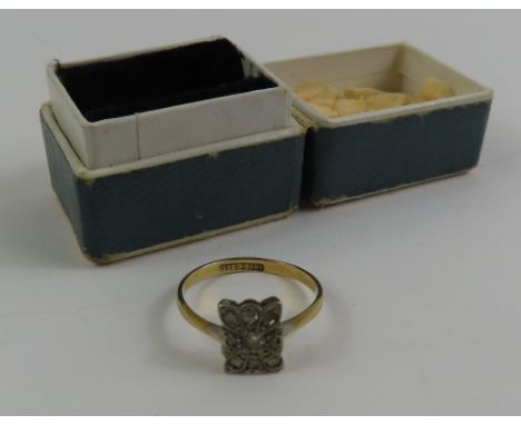 An early 20th century diamond plaque ring, marked '18ct gold', finger size L, 1.6g gross, cased