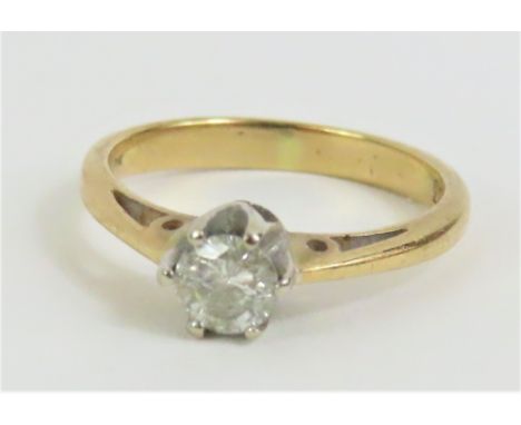 A diamond solitaire ring, marked '.33' to the inside of the band, and indistinctly marked '9k', finger size K, 1.9g gross, ca