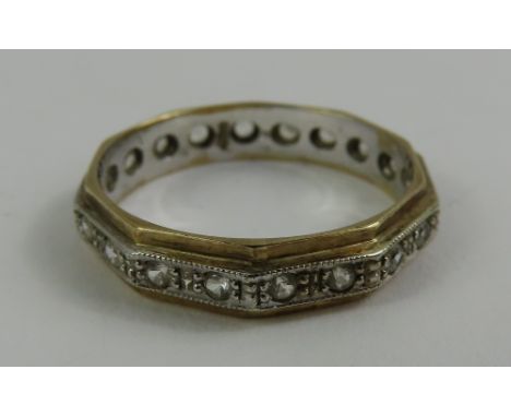 A two colour full eternity ring, marked '9ct', finger size R 1/2, 2.7g gross
