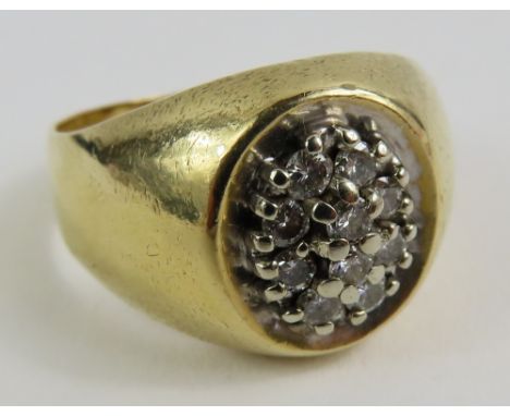 A gents diamond set ring, marked '14k', finger size V 1/2, the ten round brilliant cut diamonds weighing approximately 0.30ct