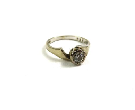 An illusion set diamond solitaire ring, the white metal marked '18ct', finger size J, 2.8g gross