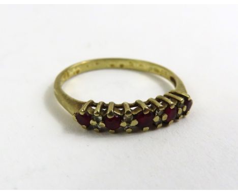 A 9ct gold ruby and diamond half eternity ring, finger size N, 1.4g gross