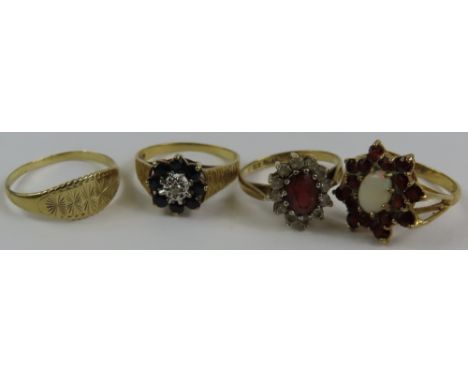 A 9ct gold sapphire and diamond cluster ring, two 9ct gold garnet dress rings and another 9ct gold ring, 8g gross