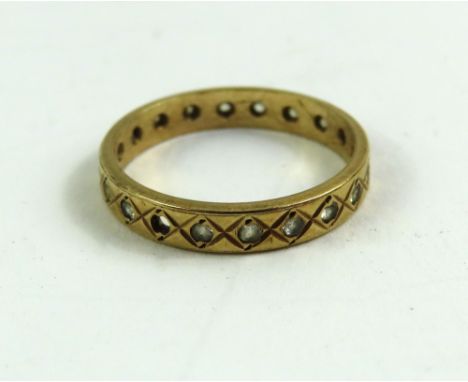 A 9ct gold white stone full eternity ring, finger size M, together with an unmarked cameo ring, finger size M, tests as 9ct g