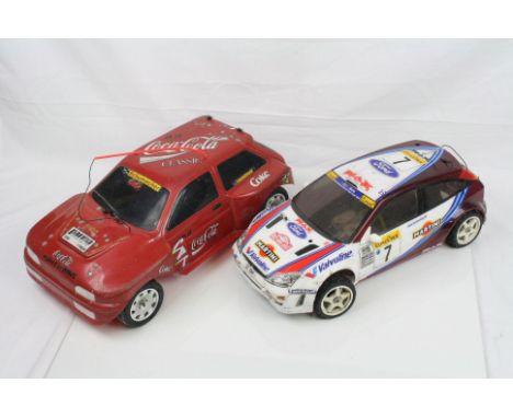 Two remote control cars to include a Schumacher 4WD Nitro Coca-Cola classic saloon car with MRC15 engine and a Kyosho 4WD Nit