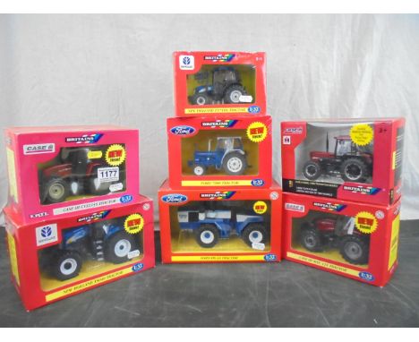 Seven boxed Britains 1/32 tractor models to include 42107 Ford FW-30, 42112 New Holland T8040, 42197 Ford 7000, 42012 Case IH