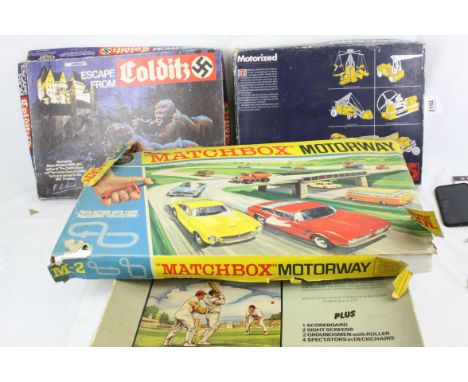 Four boxed games to include Subbuteo Cricket, Meccano 5, Parker Colditz and Matchbox Motorway M2, all unchecked but appears g
