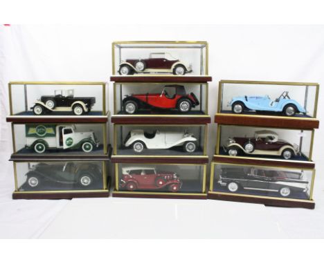 Ten cased 1:18 scale diecast model vintage vehicles to include Morgan, Alfa Romeo, Ford etc, models fixed to wooden plinth an