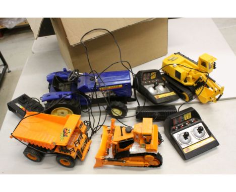 Four r/c construction and farming models to include Toy State Farm Tractor, 2 x New Bright CAT models and Toy State digger