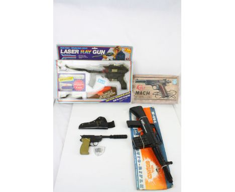Three boxed toy guns to include Japanese Colt Mach Double Barrel Gun, M-404 Machine Pistol (made in Hong Kong) and a Friction
