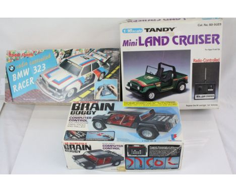 Three boxed r/c models to include 1/16 Tandy Mini Land Cruiser, Fun Dimensions The Incredible Brain Buggy and a Radio Shack R