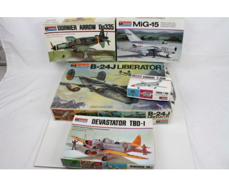 Five boxed Monogram plastic model kits, unbuilt, to include 1/48 B-24J Liberator, 1/48 Dornier Arrow Do335, 1/48 Devastator T