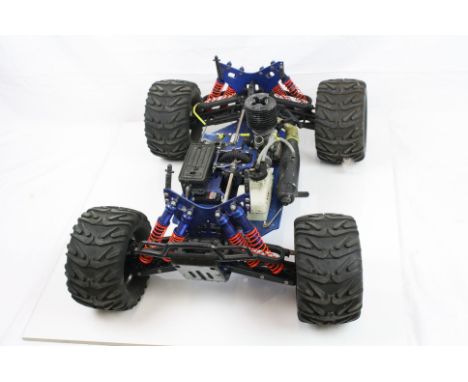 A Kyosho 4WD Monster Truck radio controlled truck chassis with power 4.01 Force 25 engine.