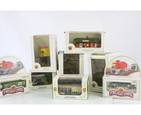 Six boxed Bachmann N gauge Railroad Buildings to include 45810 Water Tank, 45908 Passenger Station, 557403 New Car Showroom, 