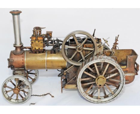 Live Steam Traction Engine of early design. Model measures 12 inches tall x18 inches long, front axles measures 6.5 inches ou