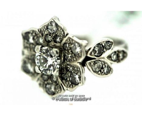 18ct white gold diamond ring, central round brilliant cut diamond surrounded by diamond melee's creating a stylised flower cl