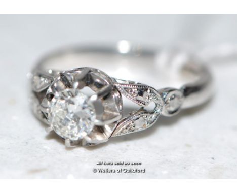 An 18ct white gold diamond ring with diamond set openwork shoulders.