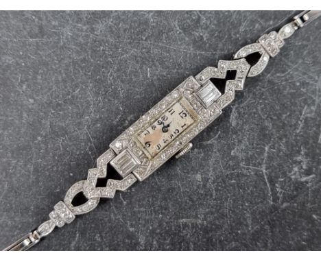 A late 1920s platinum and diamond encrusted manual wind cocktail watch, 10mm x 23mm, on expanding bracelet.