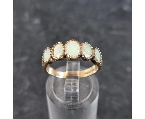 A 9ct gold opal five stone ring, size O1/2, gross weight 3.1g.