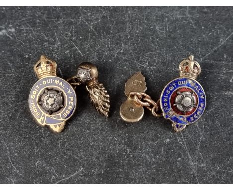 A pair of yellow &amp; white metal and enamel Royal Fusiliers cufflinks, stamped 'BN', the crest 24mm high.