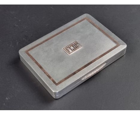 An engine turned silver cigarette case, by&nbsp;W H Manton Ltd, Birmingham 1946, 8cm wide, 98g.
