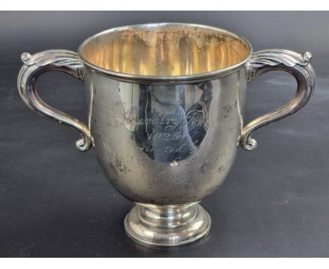 A large silver twin handled trophy cup, by Garrard &amp; Co Ltd, London 1922, with inscription, 18.5cm high, 665g.