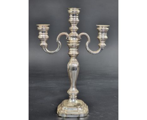 A German white metal three light candelabrum, stamped '925S', 27.5cm high.