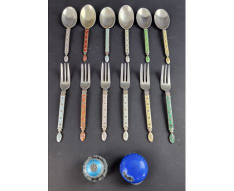 A set of six Norwegian white metal and enamel cake forks with six matching spoons; together with two other white metal and en