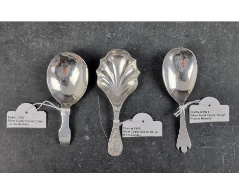 A George IV Irish silver caddy spoon, by Joshua Buckton, Dublin 1824; together with two other silver caddy spoons, 43g. (3)