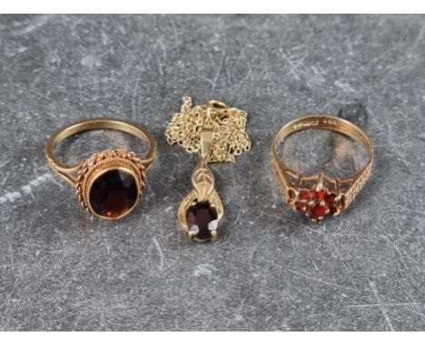 A 9ct gold garnet pendant, on 9ct gold chain; together with a 9ct gold floral cluster ring, set seven garnets, size K1/2; and