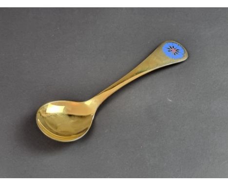 A Georg Jensen silver gilt and enamel '1972' spoon, stamped 'Sterling Denmark, 925'.